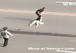 Asian caveman drags her wife by her hair across the road 1