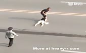 Asian caveman drags her wife by her hair across the road 6