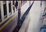 India - a man trying to get off the train in motion 1