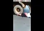 A woman wedged alive under truck tires 2