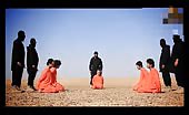 Isis – beheading and puts head on spikes 11