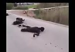 Burned corpses on road display 1