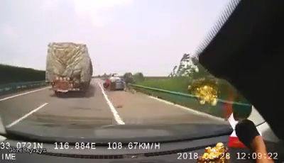 Car tries to overtake a truck, hit 2 men stopping on the side 8