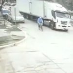Man rides a bicycle into a truck's blind spot as it makes turn and get wiped 2