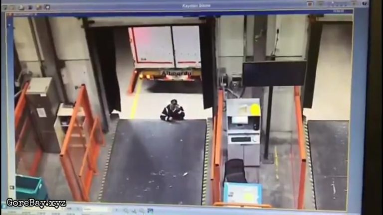 Man standing in front of loading dock crushed by a reversing truck 11