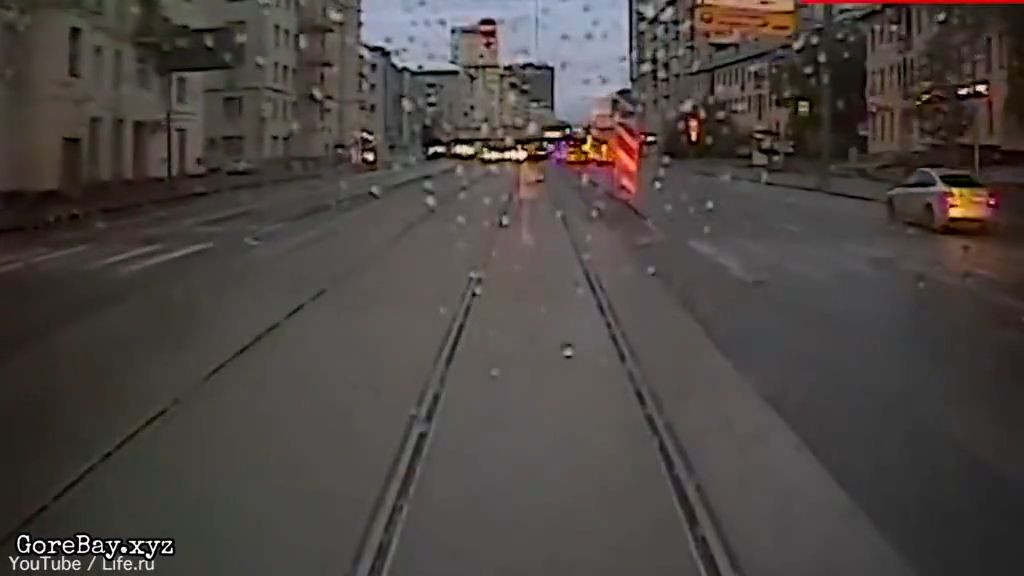 Woman on phone runs over by a tram 7