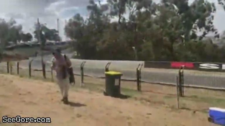 Racing car slides and crashes at a track corner 13