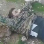 Soldiers having fun with enemy's dead body 1