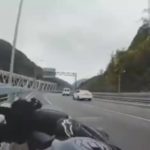 Female biker rides against traffic and wipes herself to the divider 1