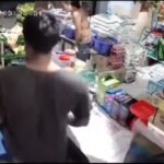 Shop owner wrestles with his customer 1