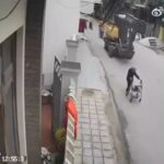 Old woman pushing a trolley crushed by an excavator 1