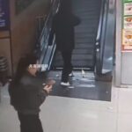 Woman steps into the gap on travelator 1