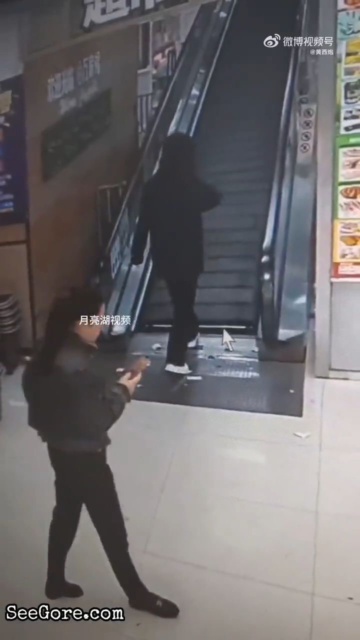 Woman steps into the gap on travelator - SeeGore