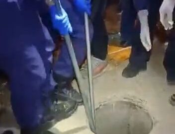 Bloated man pulled out from a hole 22