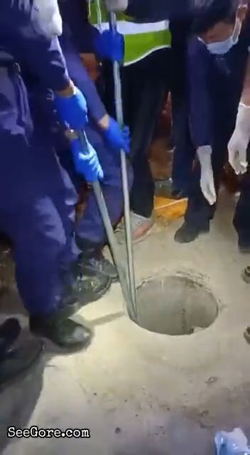 Bloated man pulled out from a hole 5