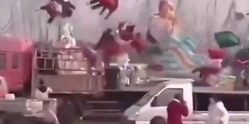 Swing ride slamming people into a truck 14