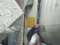 Man Stuck Between Trucks 10