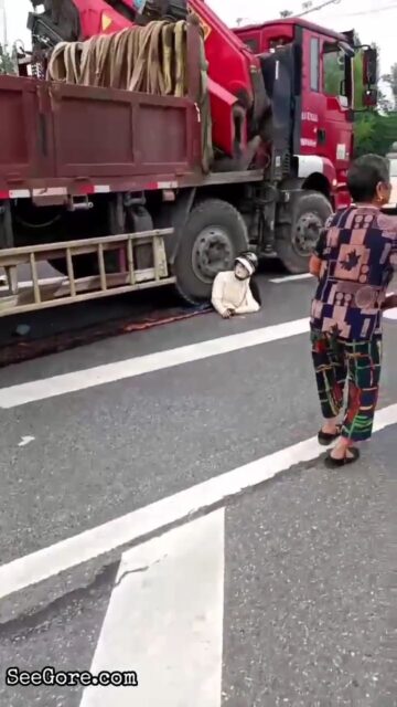 Woman Calmly Making Her Last Phone Call Under Truck Tyre 1