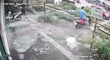 Motorcyclist Stops On Railway and Hit by a Train 1