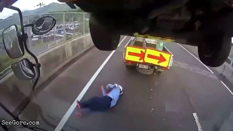 Truck Stops, Car Falls Onto Road Worker 25