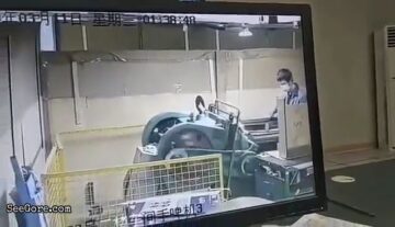 A Man Pulled into a Pressing Machine 1