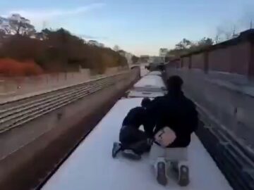 A Group of Men Risking Their Life on a Moving Train 18