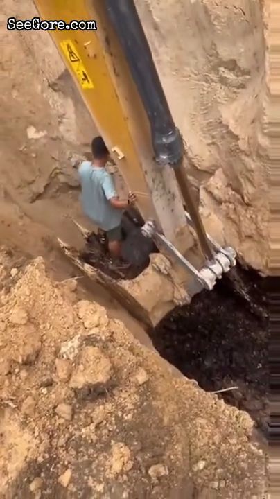 Stupid Worker Doing Stupid Stuff in a Hole at Site 1
